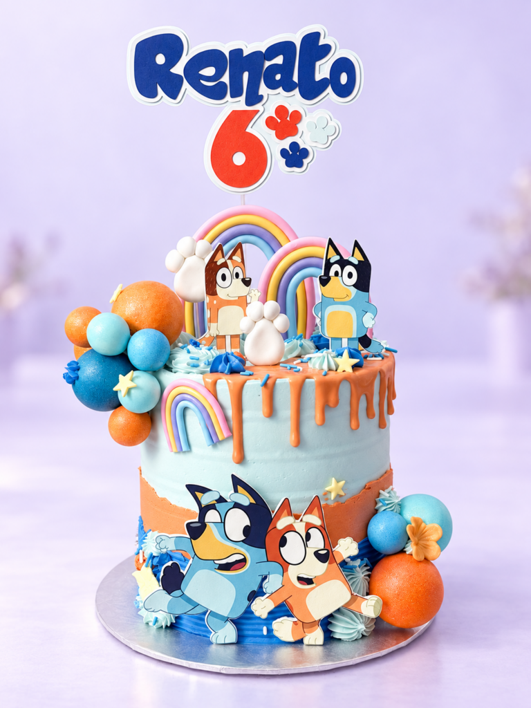 Bluey-themed sixth birthday cake with orange and blue decorations
